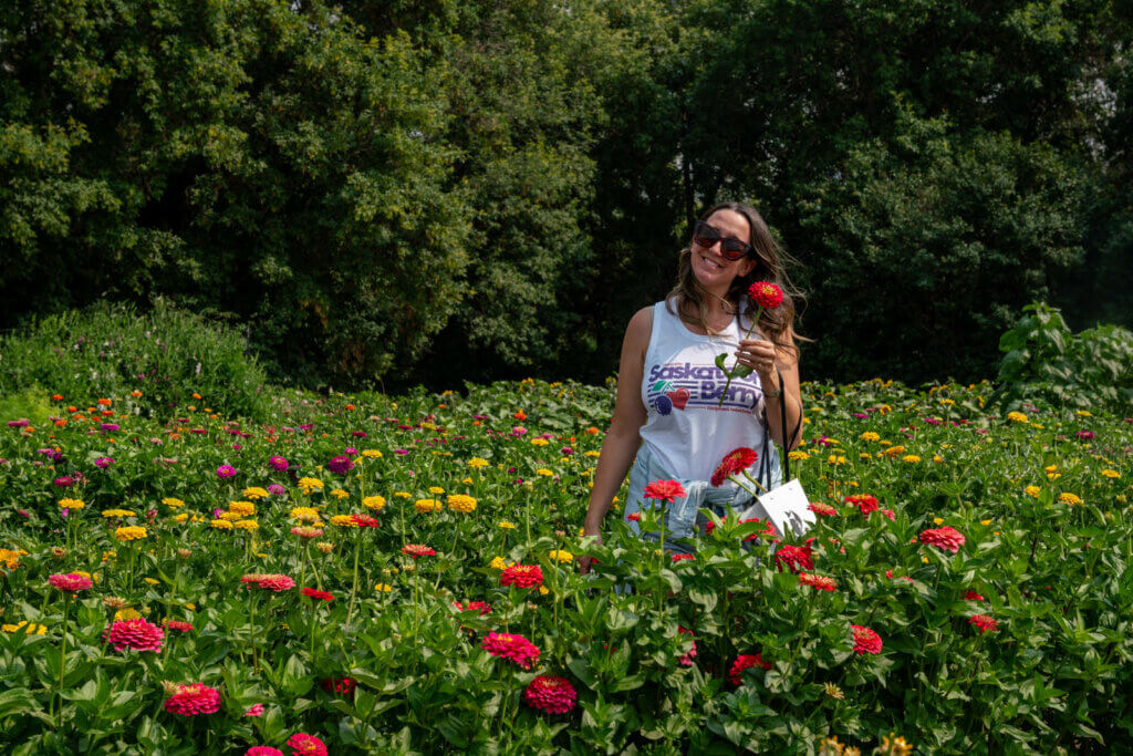 Megan picking flowers at Black Fox Farm and Distillery in Saskatoon Canada