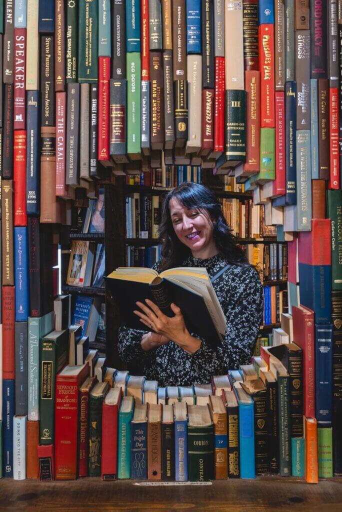 Megan reading a book at The Last Bookstore in Los Angeles