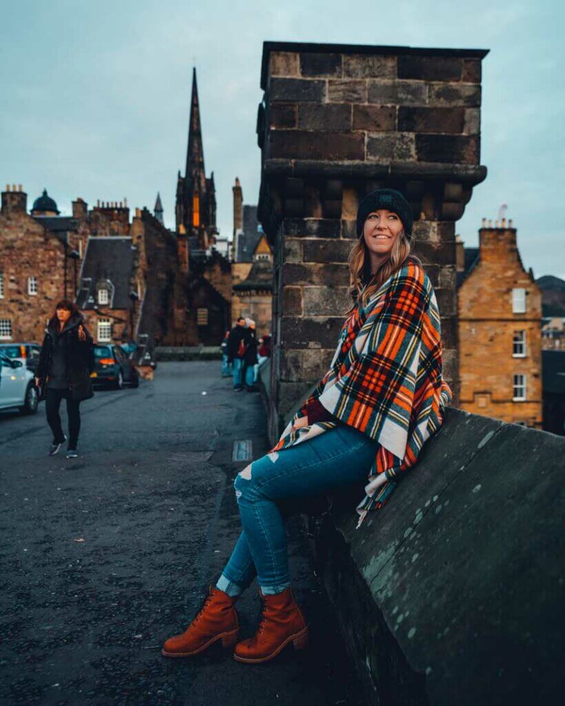 Megan sitting at Edinburgh Castle in Scotland