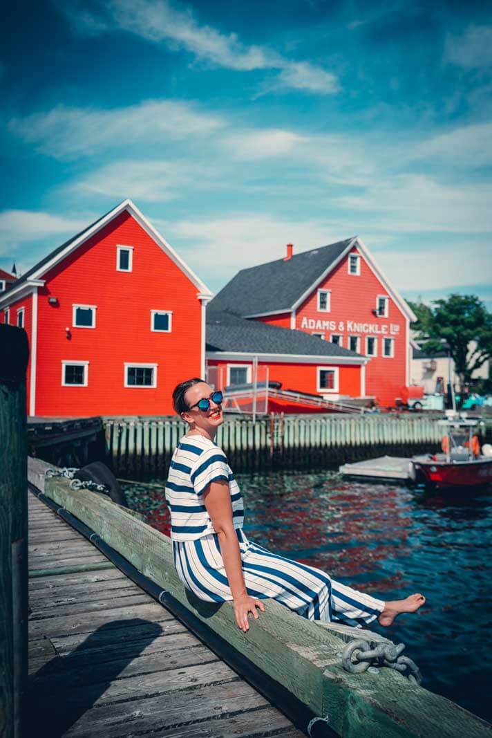 Megan sitting at the dock in Lunenburg in Nova Scotia