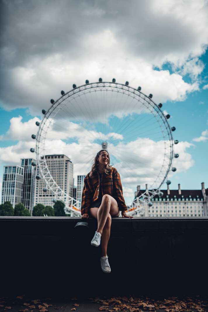 Megan sitting in front of the London Eye