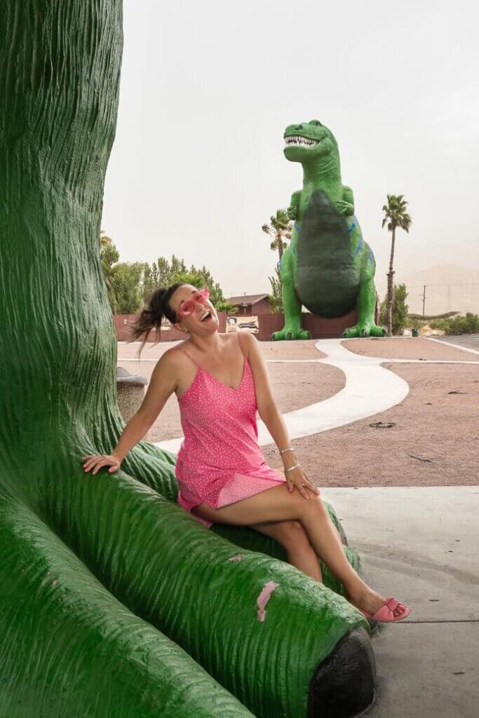 Megan sitting on the Cabazon Dinosaurs the Worlds Biggest Dinosaurs near Palm Springs California