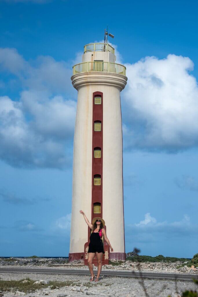 Megan standing in front of Willemstoren Lighthouse in Bonaire