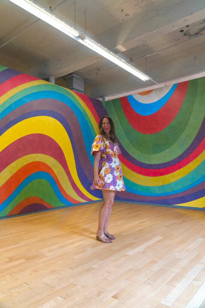 Megan-standing-in-front-of-a-mural-by-Sol-LeWitt--A-Wall-Drawing-Retrospective-in-MASS-Moca-in-North-Adams-Massachusetts-Berkshires