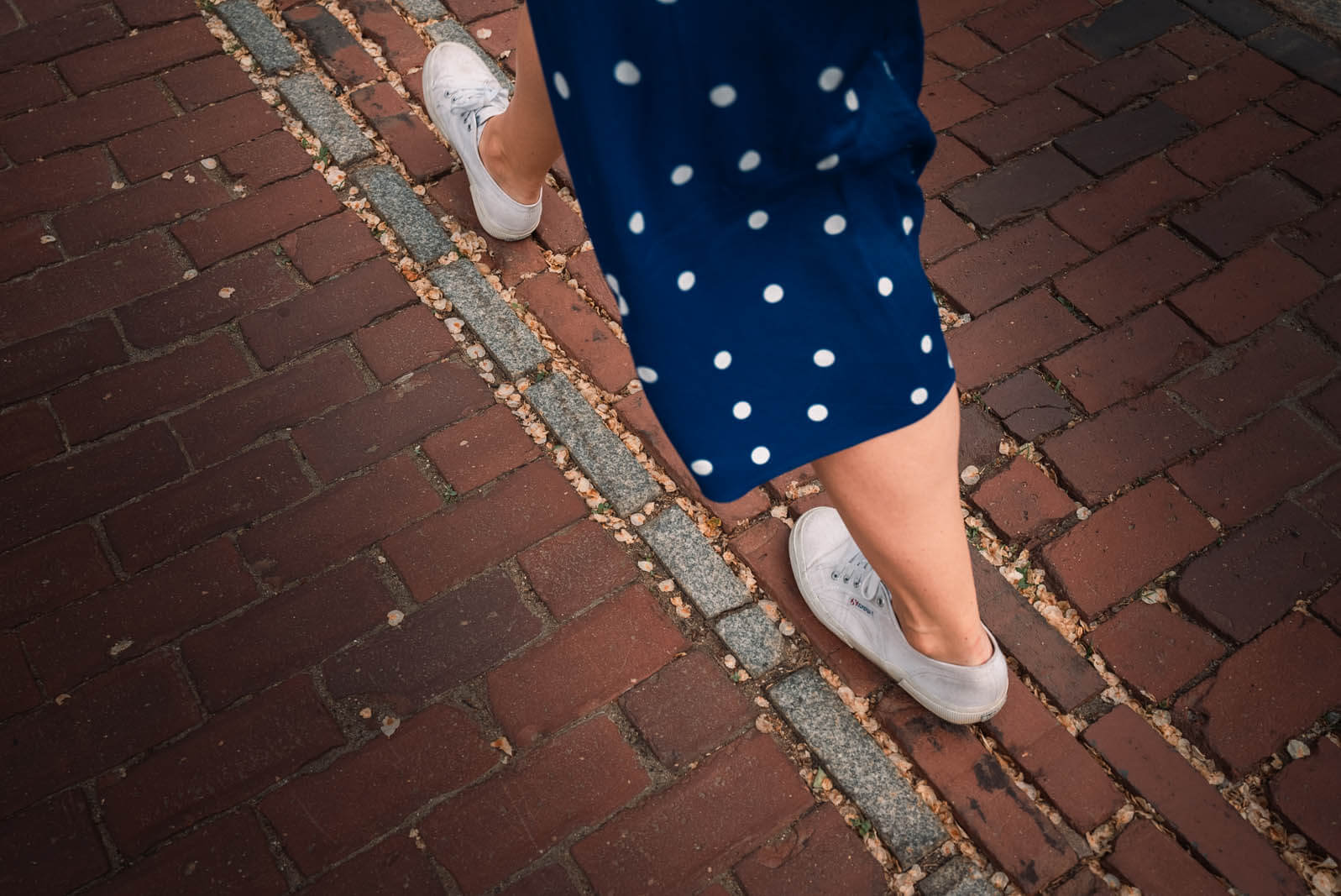 Megan walking along the Boston Freedom Trail brickway path