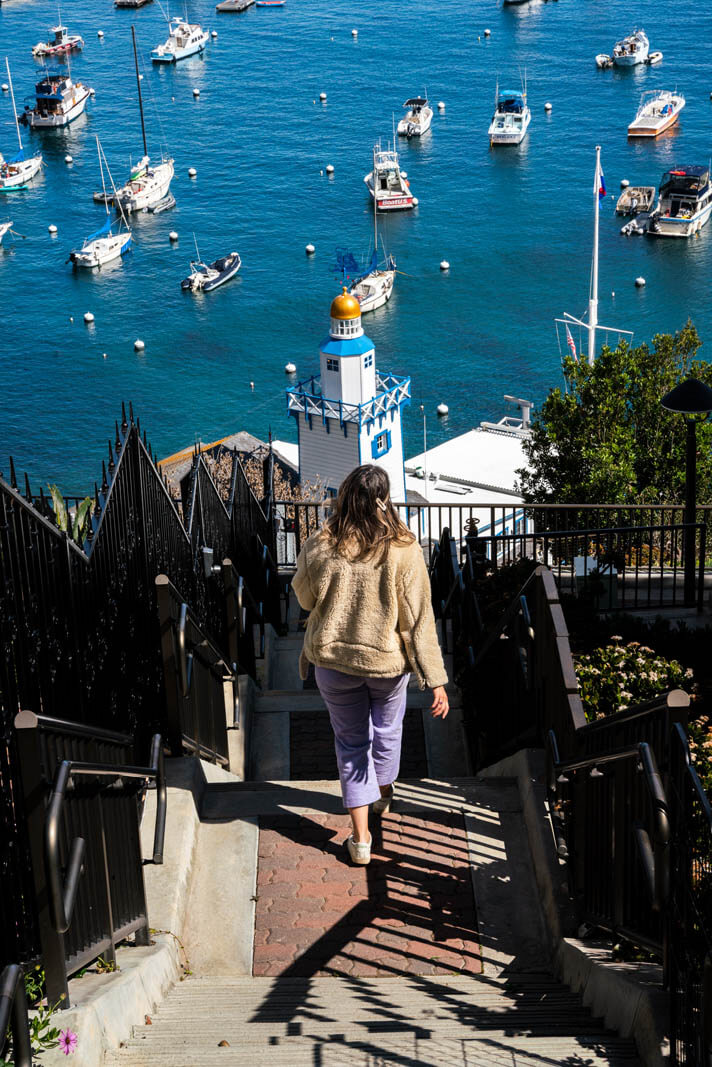 Megan walking down the staircase toward the water on Catalina Island in California