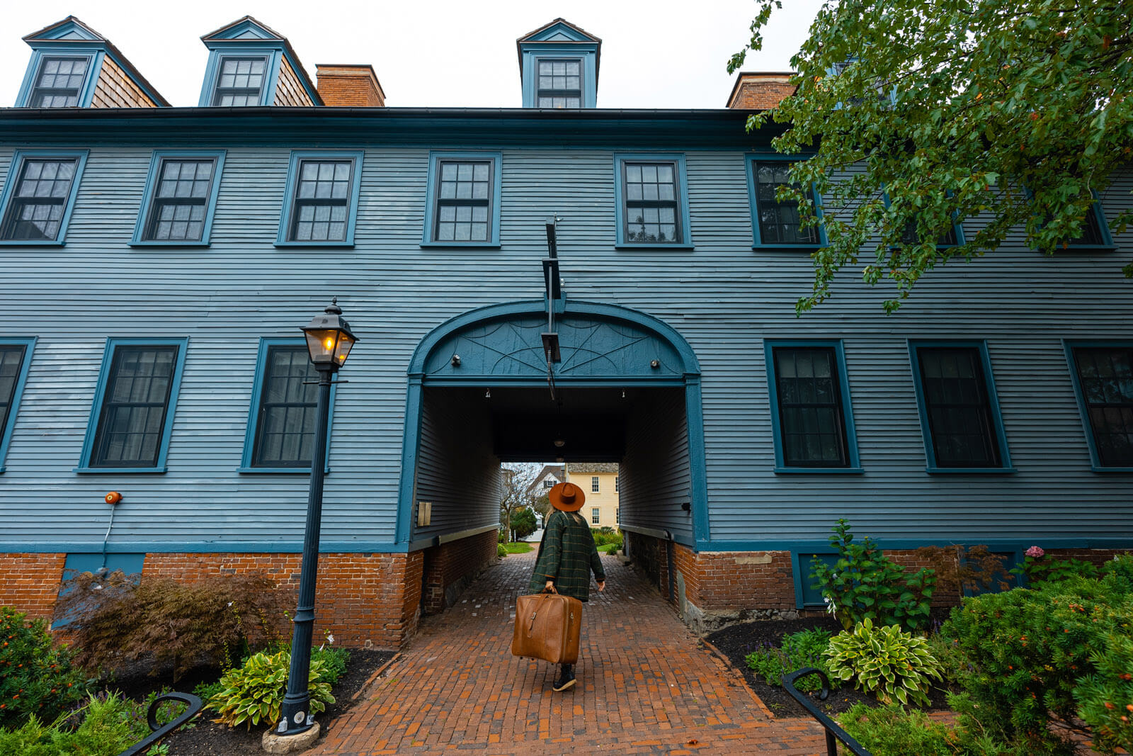 Megan walking into the Inn Downtown in Portsmouth New Hampshire