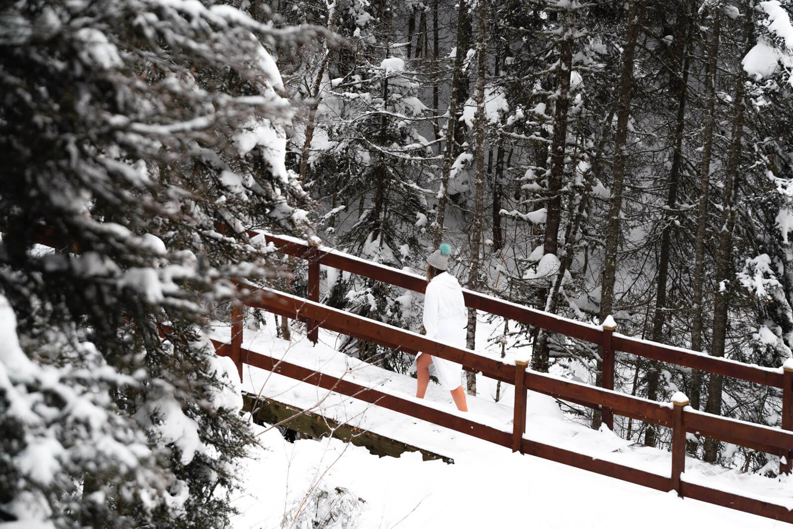 Megan walking outside in the winter at L'Eternal Spa in monts valin Saguenay-lac-Saint-Jean quebec canada