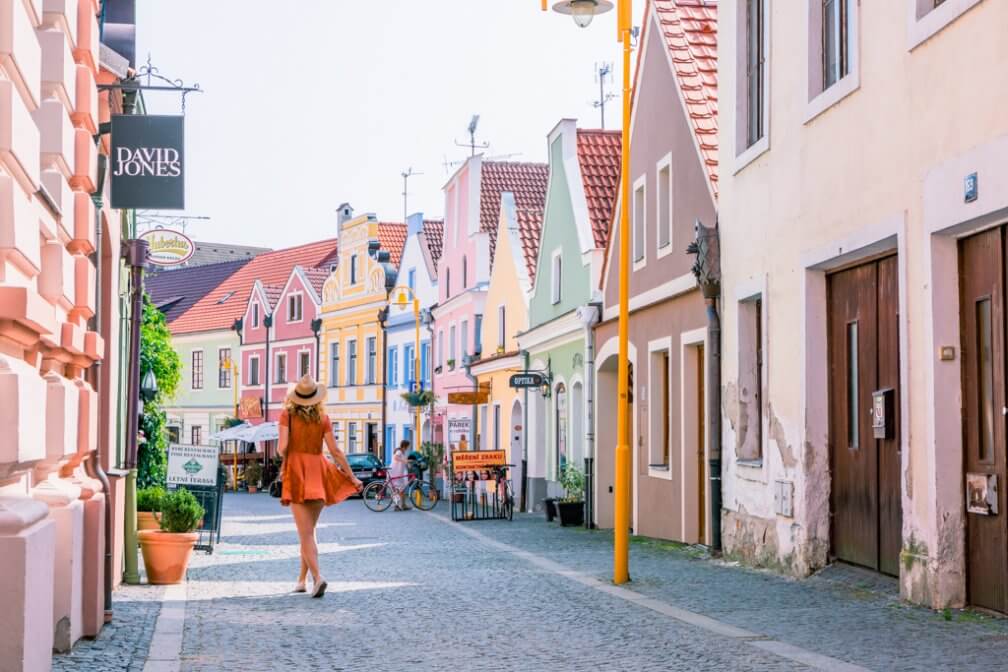 Megan walking through the colorful streets of Trebon Czech Republic