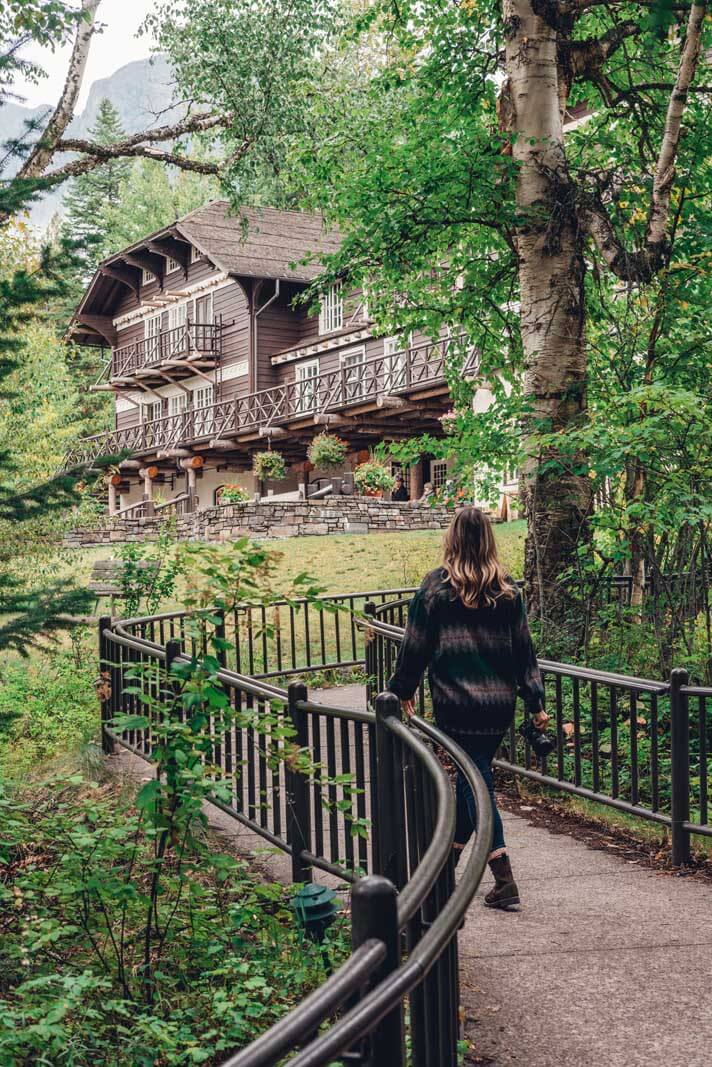 Megan walking toward Lake McDonald Lodge in Glacier National Park in Montana