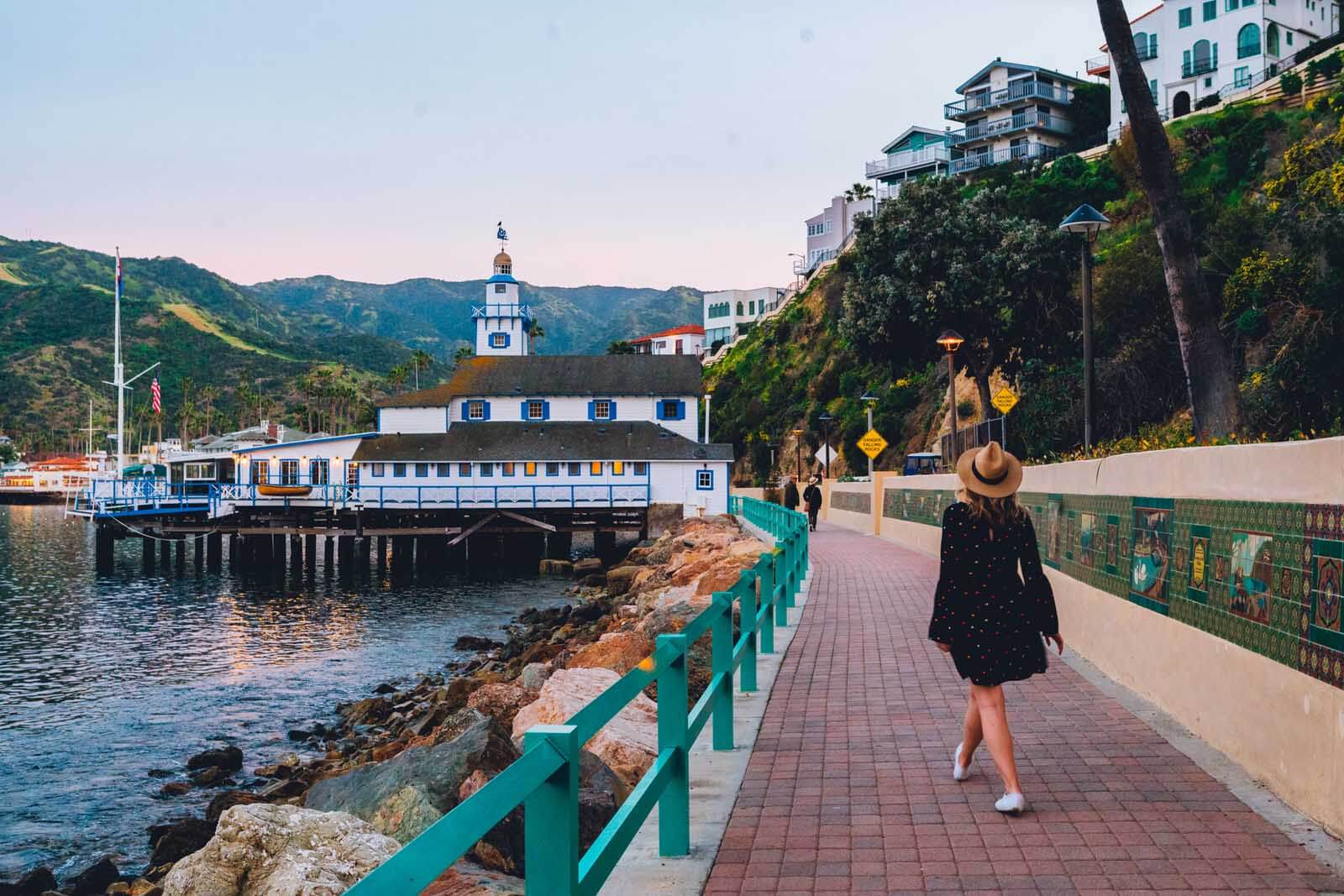 Megan walking toward to Catalina Yacht Club from Descanso Beach on Catalina Island at dusk