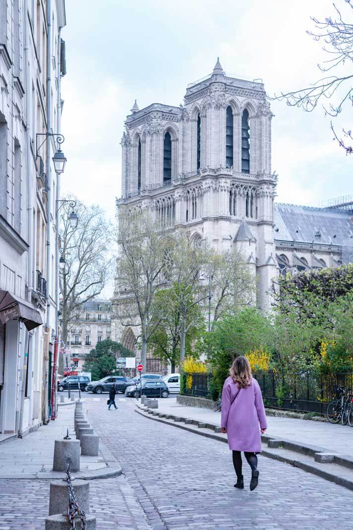 Megan walking towards Notre Dame Cathedral in Paris France