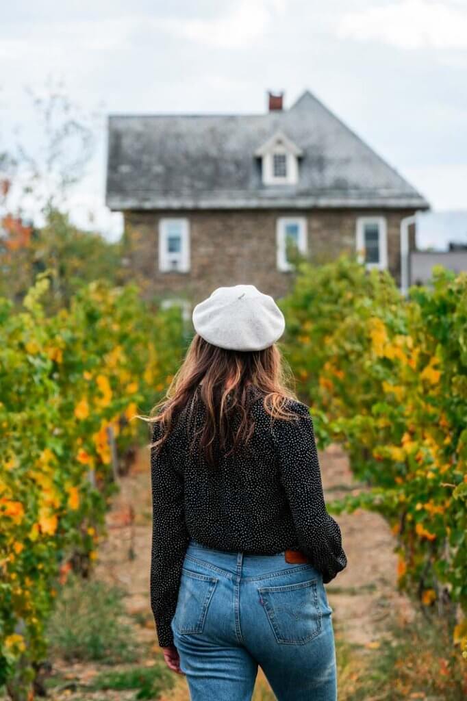 Megan wearing a beret at Dr Frank winery in Finger Lakes New York
