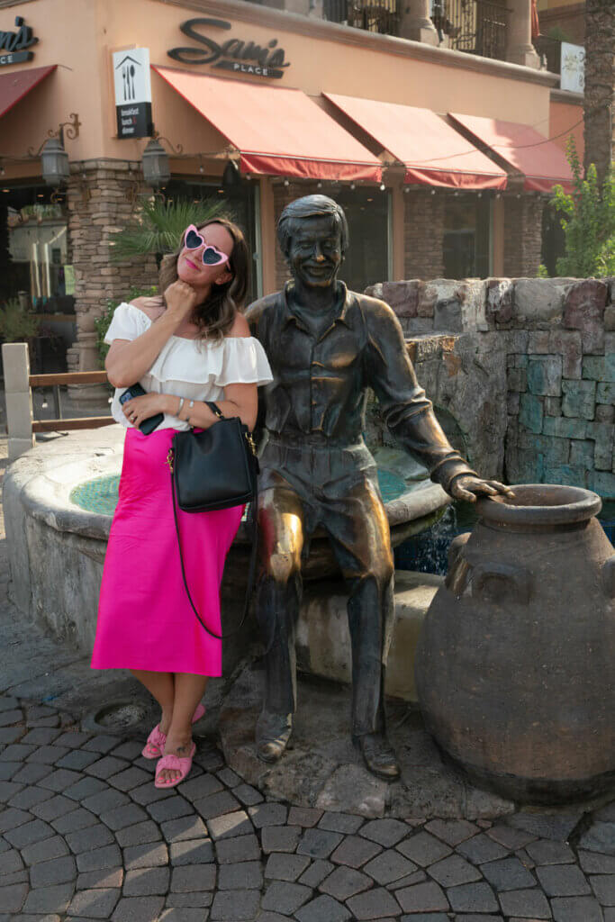 Megan-with-the-Sonny-Bono-statue-in-downtown-Palm-Springs-California