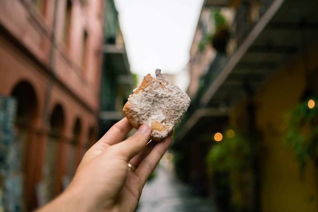 a delicious beignet in the streets of new orleans French Quarter