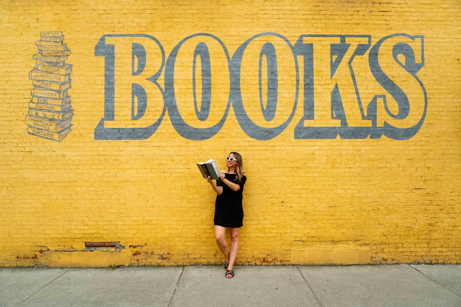 Megan posing in front of the Owego book store