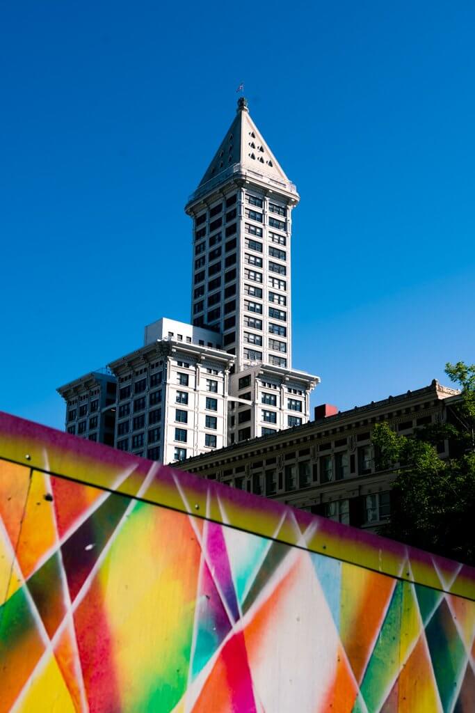 colorful mural with Smith Tower in the background