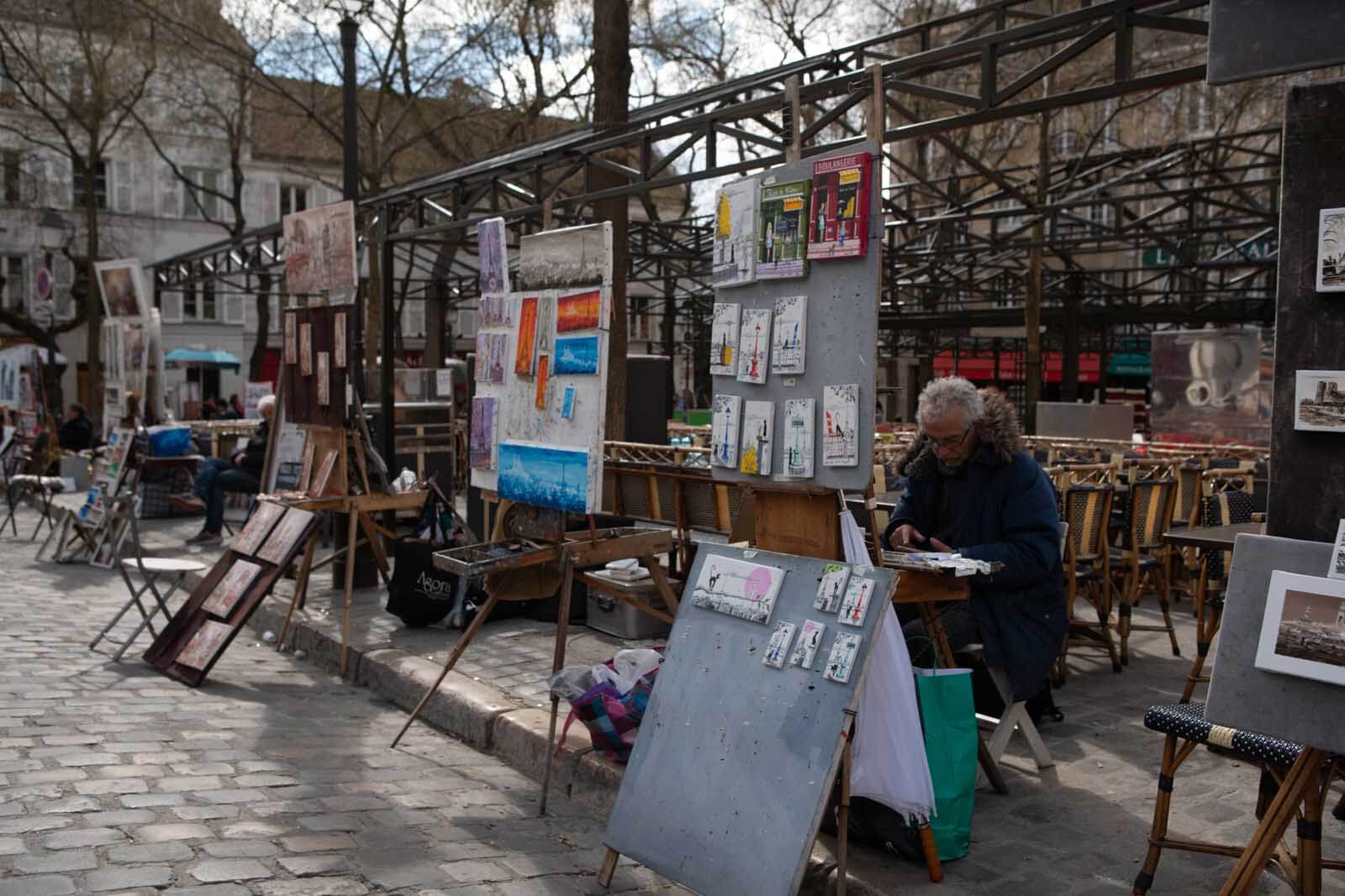 Place de Tertre artists at work in Montmartre Paris