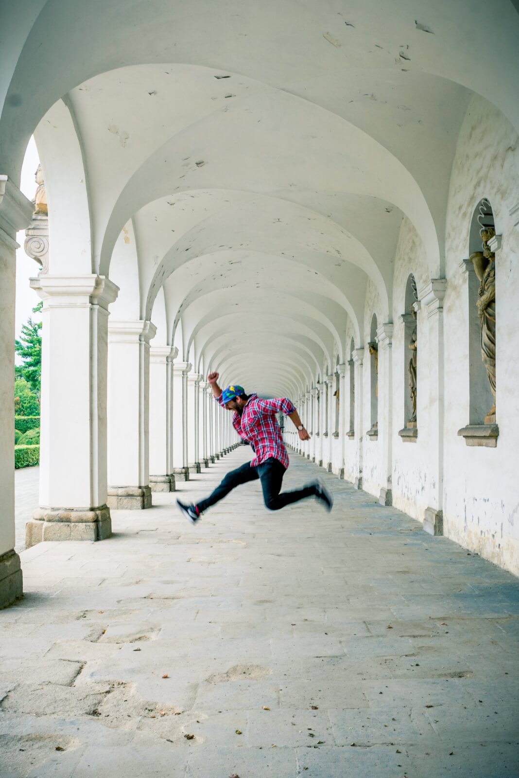 Scott jumping in the colonnade in the Castle gardens of Kromeriz