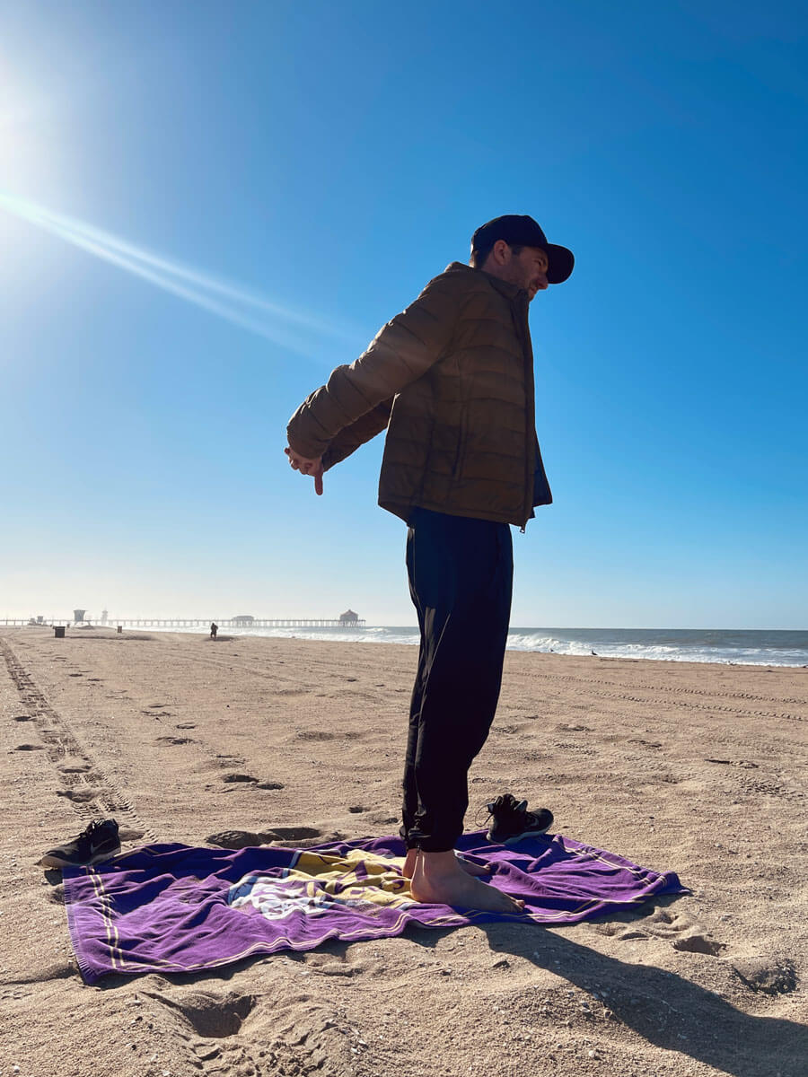 Scott-enjoying-yoga-on-the-beach-at-Huntington-Beach