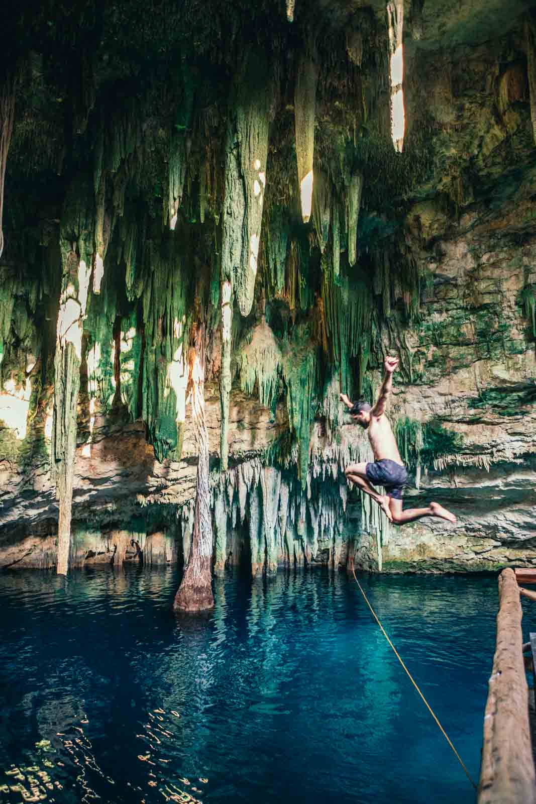 Scott jumping into Santa Barbara Cenote in Homun