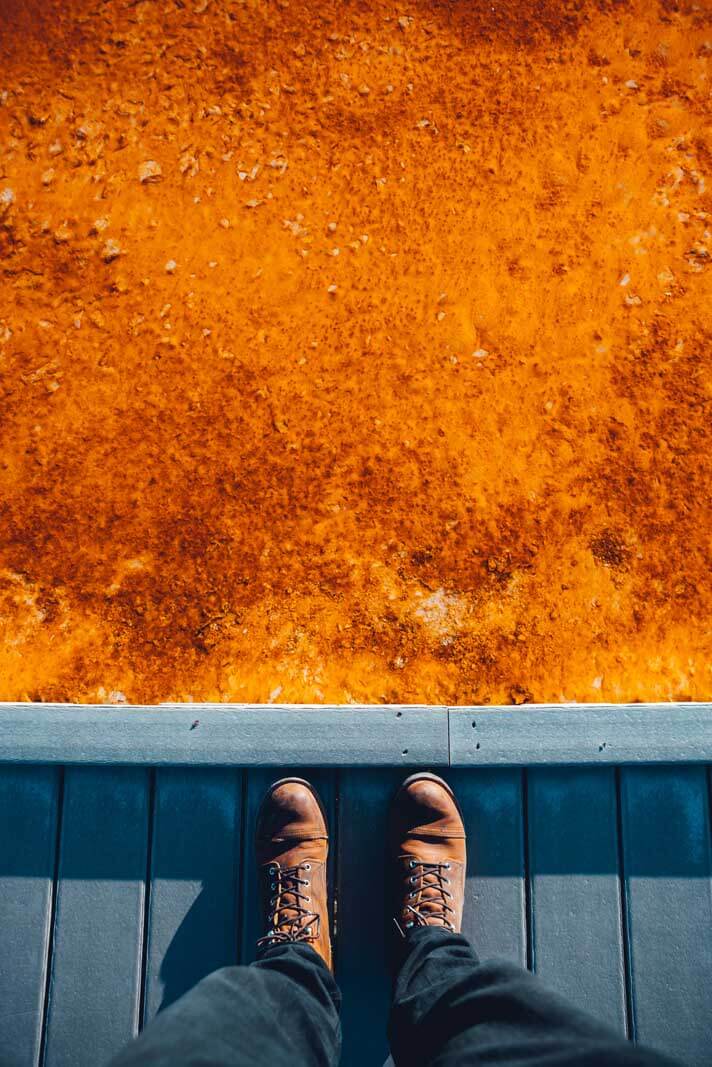 Scott looking down at the boardwalk at Grand Prismatic Spring in Yellowstone National Park