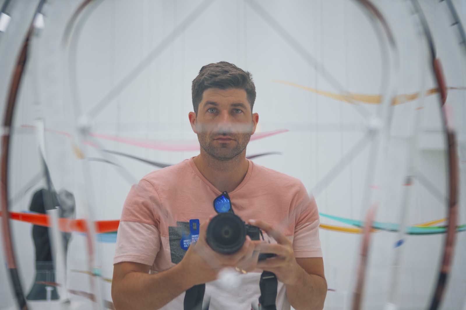 Scott photographing his reflection in the Corning Museum of Glass