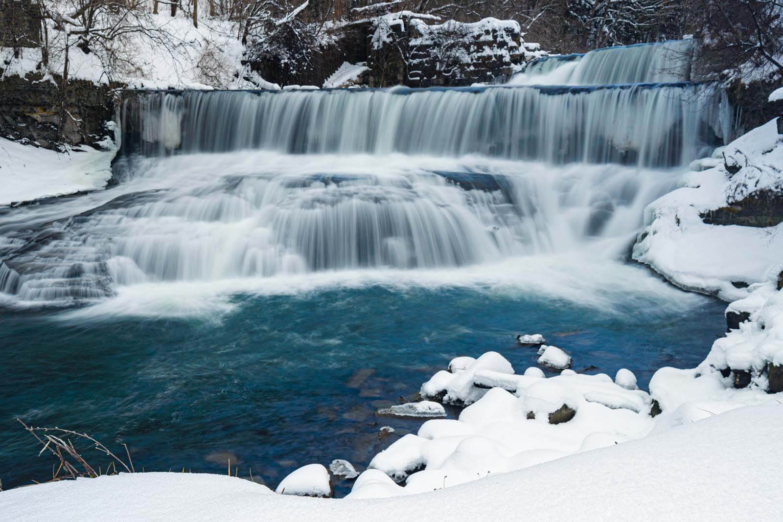 Seneca Mills Waterfall on the Keuka Outlet Trail in winter in Finger Lakes Wine Country New York