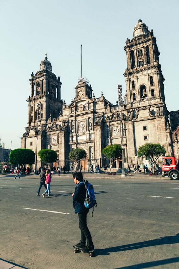 Skateboarder in front of Metropolitan Cathedral in Mexico City