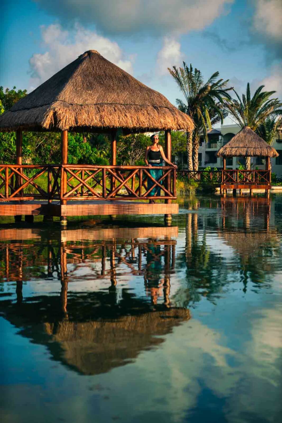 Thatched roof hut overlooking pond at Moon Palace Cancun