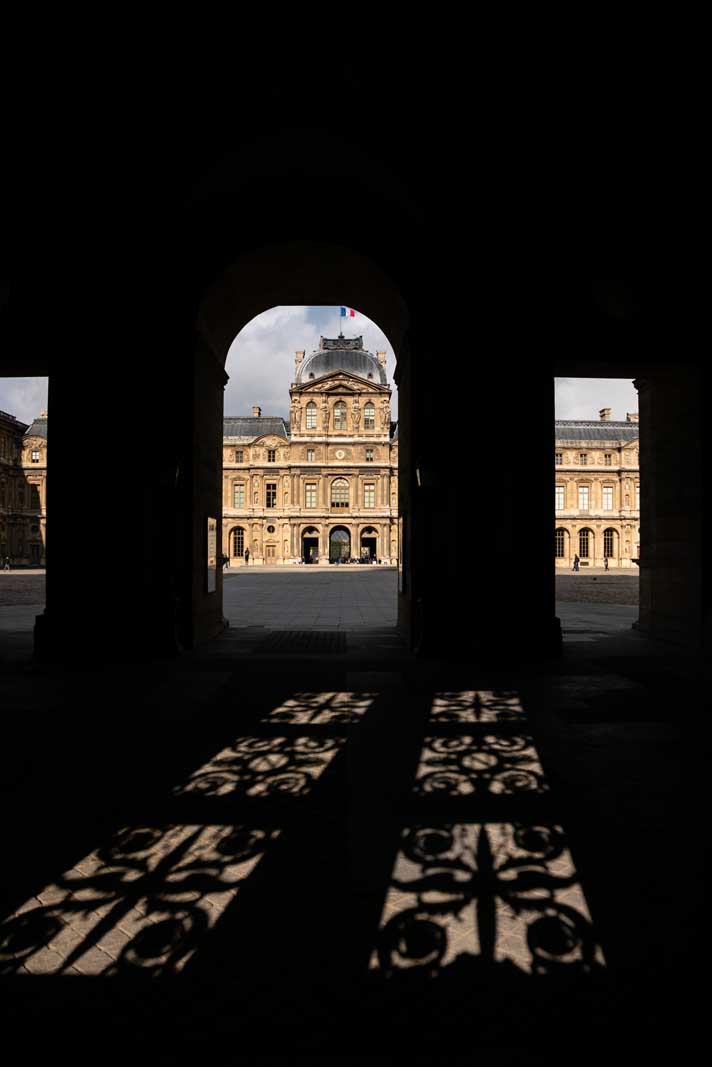 The Louvre Museum in Paris through the shadows