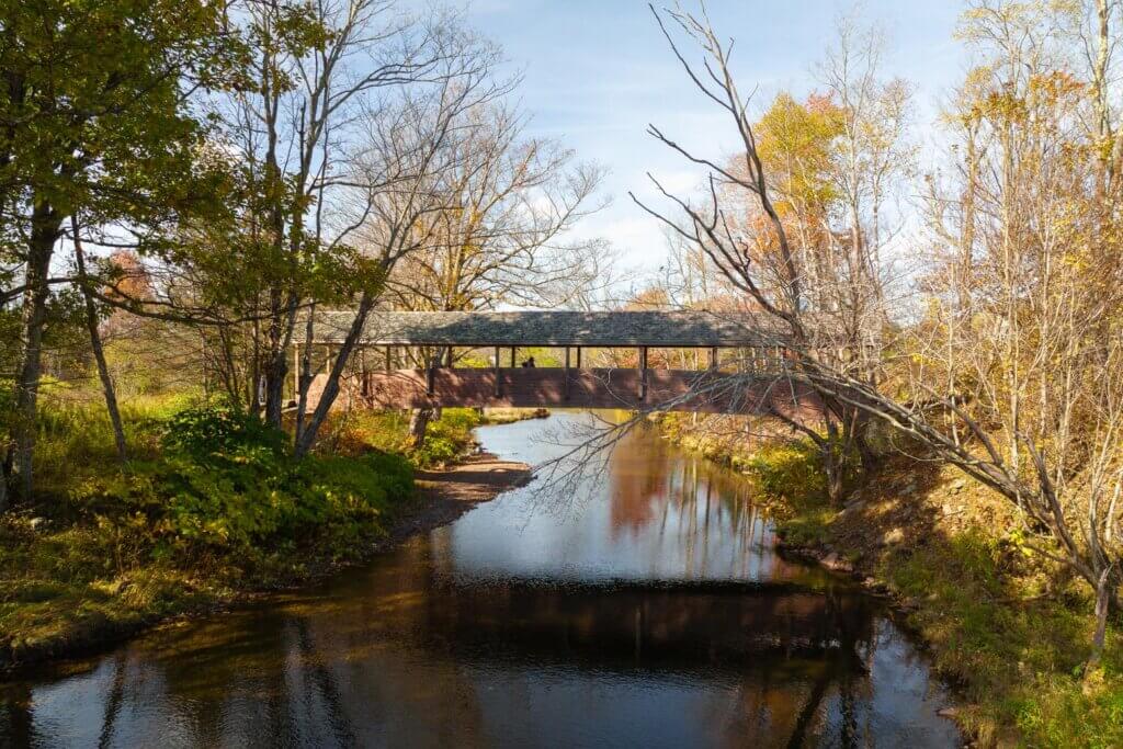 The covered bridge at the Wyndham Path in the Catskills NY in the fall