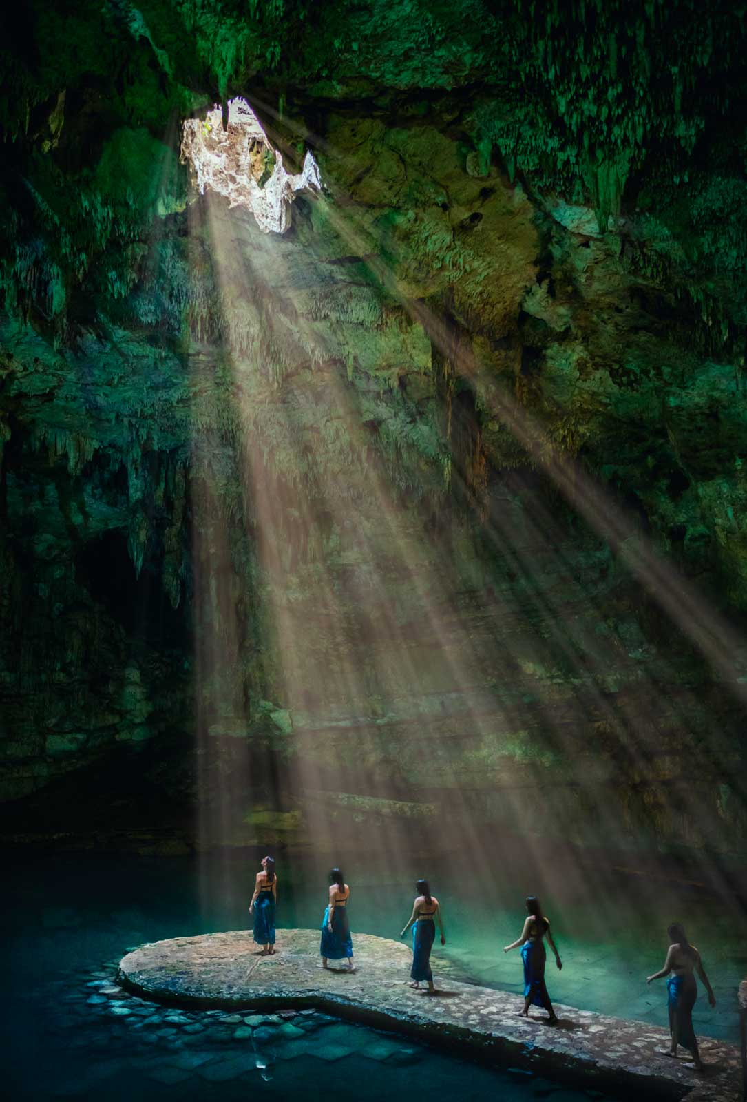 The light shining through on Megan in the Suytun Cenote near Valladolid