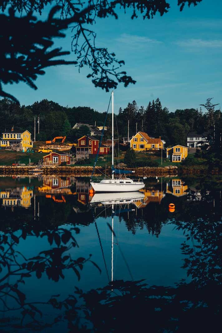 the boat floating and reflection in the water in Hubbards Nova Scotia