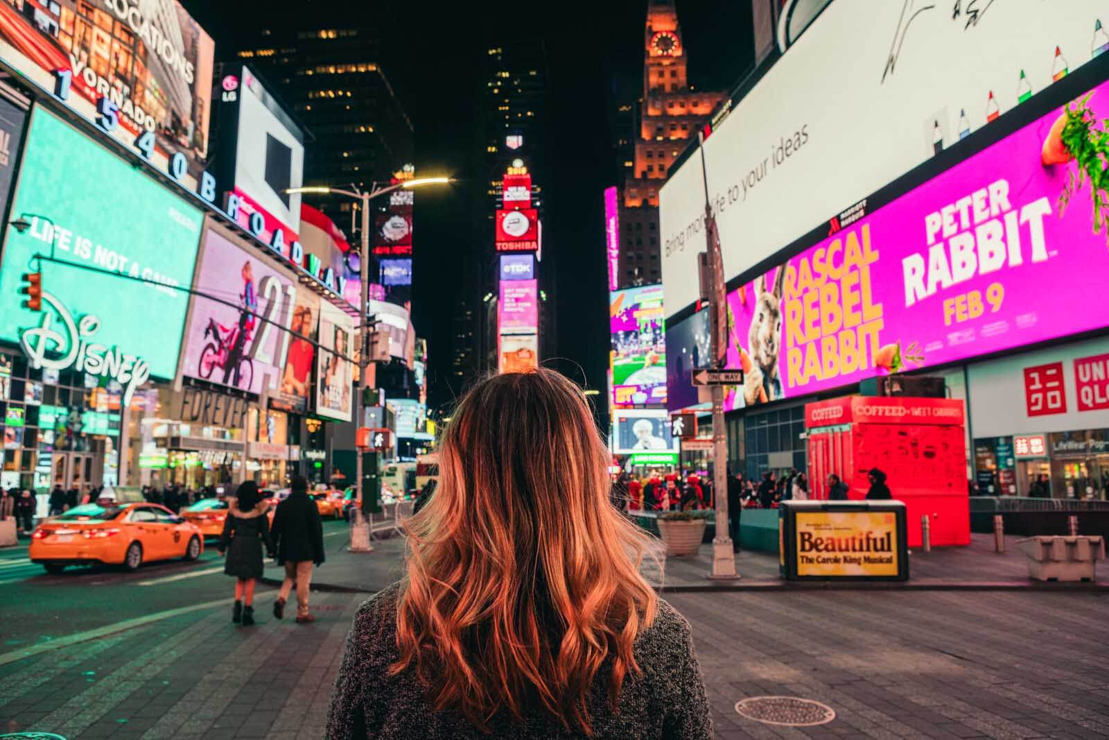 Megan in Times Square at night