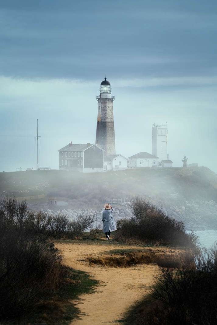 View of Montauk Point Lighthouse from Camp Hero State Park Bluffs in the Hamptons New York