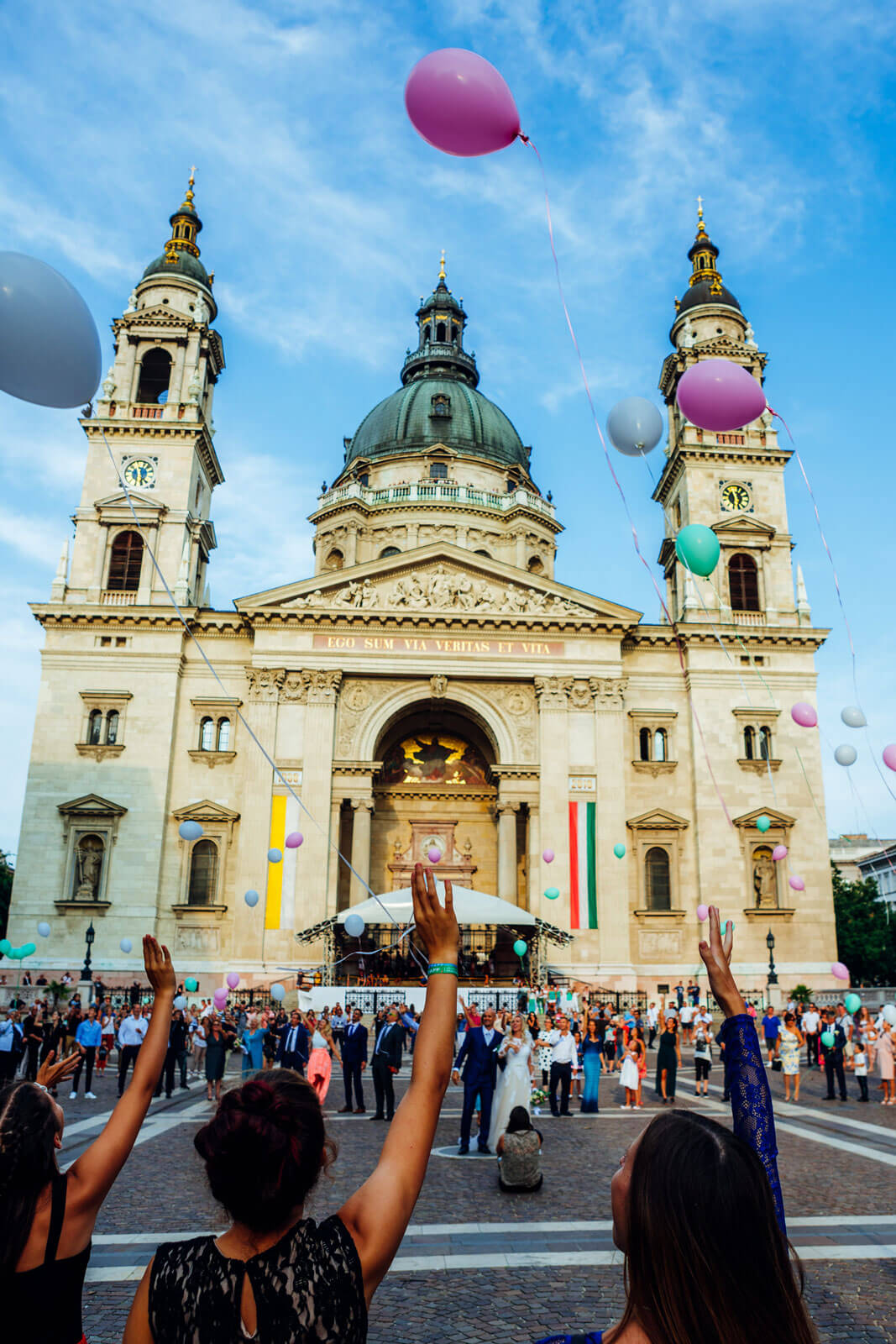 Wedding and balloons being released outside st stephens basilica