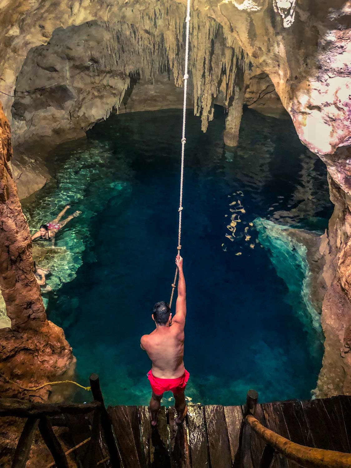 Scott looking like Tarzan about to swing into the Xtojil Cenote in Cuzama