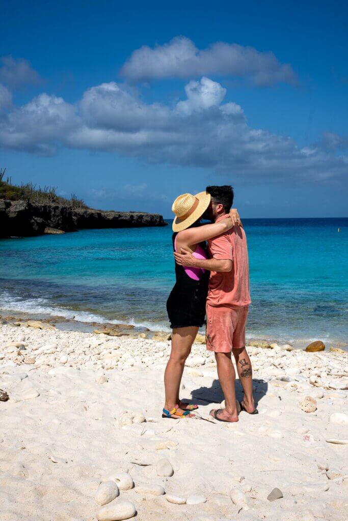 a couples kiss in paradise at Boka Slagbaai inWashington-Slagbaai National Park in Bonaire