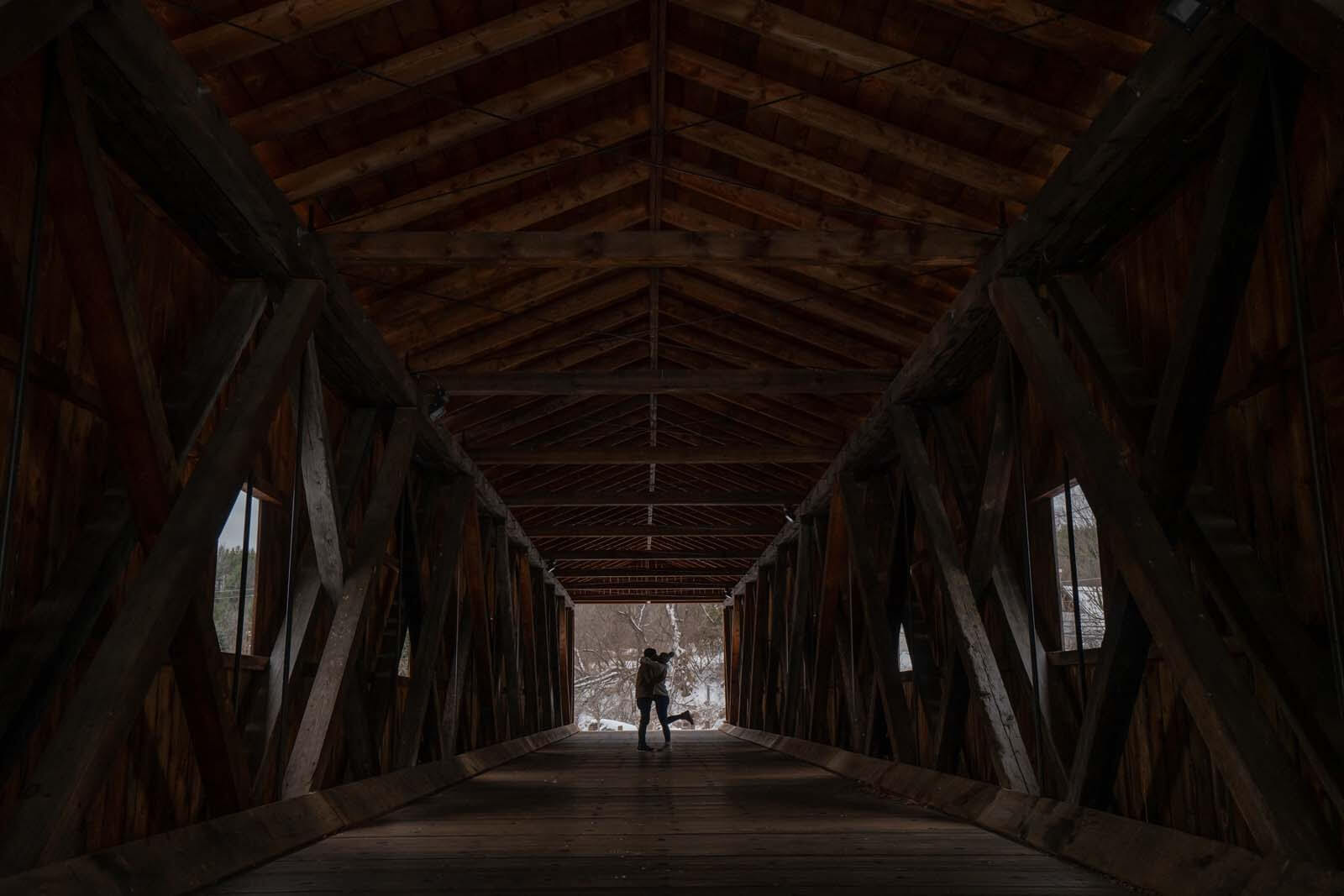 a kiss inside Jay Covered Bridge in the Adirondacks New York