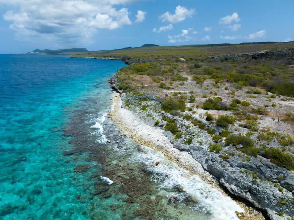 aerial view of coral reef and blue water along Queens Highway (Between Tolo and Rappel dive sites) in Bonaire