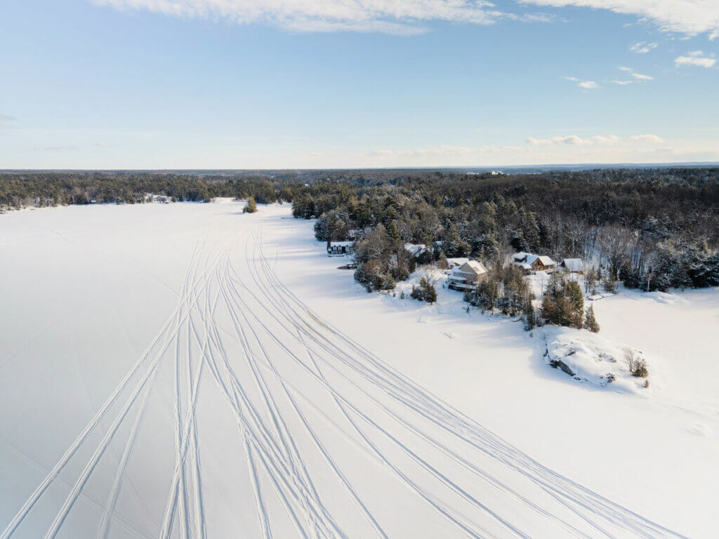 aerial-view-of-snowmobile-tracks-in-the-Adirondacks-in-winter