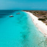 aerial view of the long stretch of white sand and blue beach at Klein Curacao