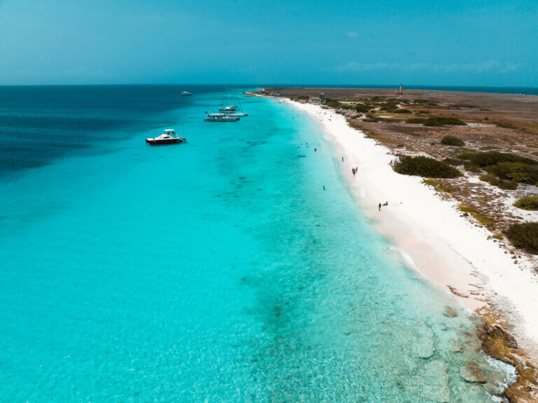 aerial view of the long stretch of white sand and blue beach at Klein Curacao