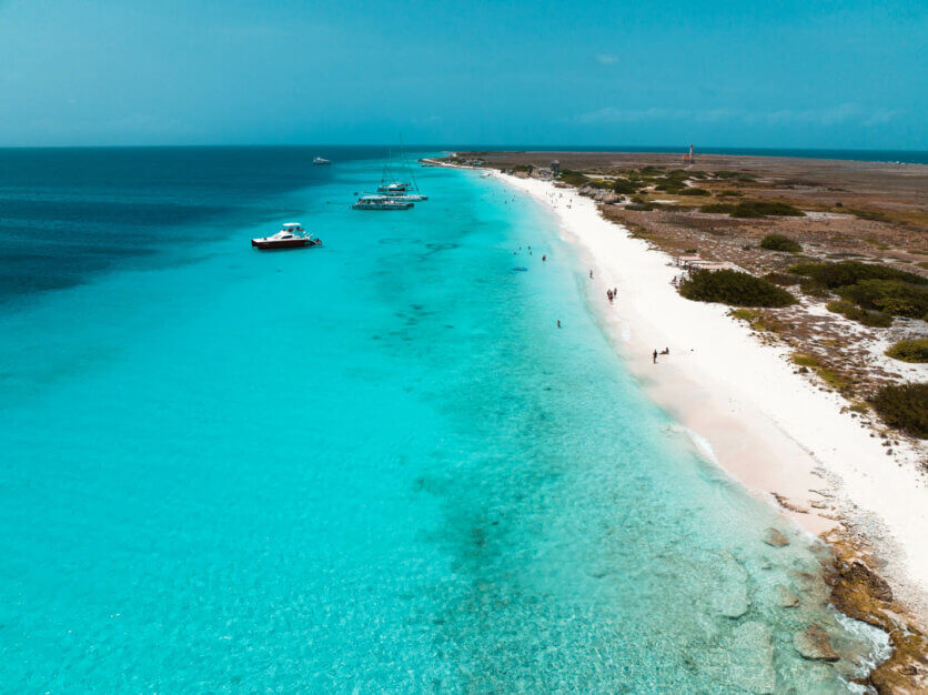 aerial view of the long stretch of white sand and blue beach at Klein Curacao