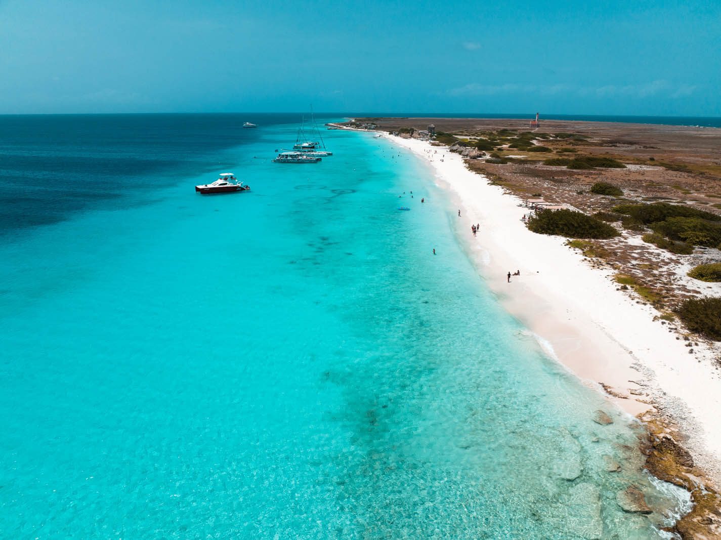 aerial view of the long stretch of white sand and blue beach at Klein Curacao