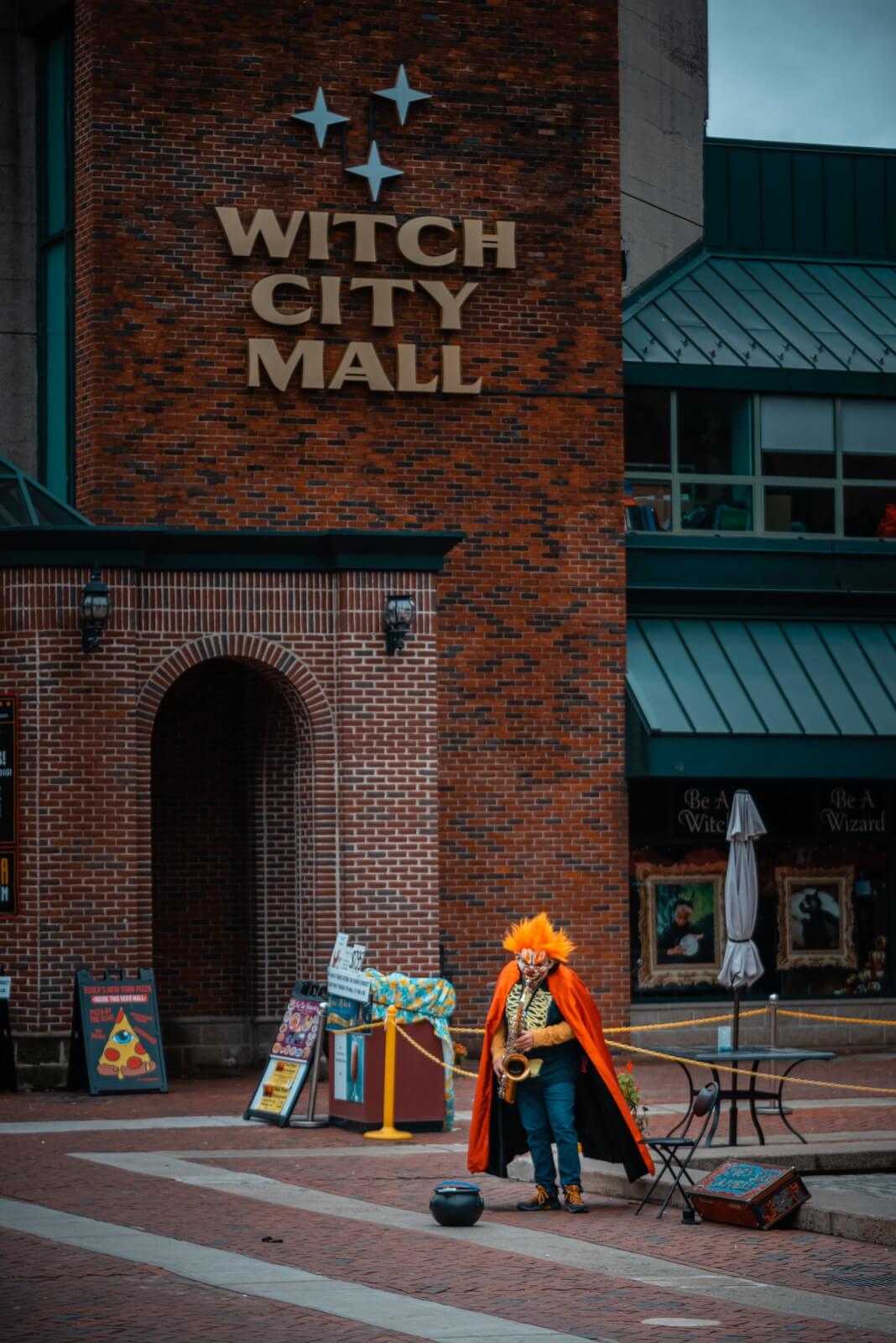 clown saxaphone man outside of witch city mall in salem massachusetts