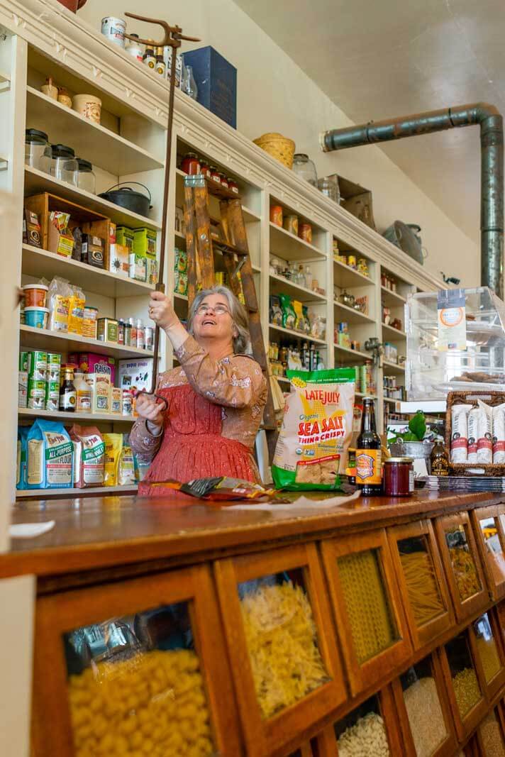 Demonstration of an antique in Columbia Mercantile 1855 in Columbia State Historic Park near Yosemite