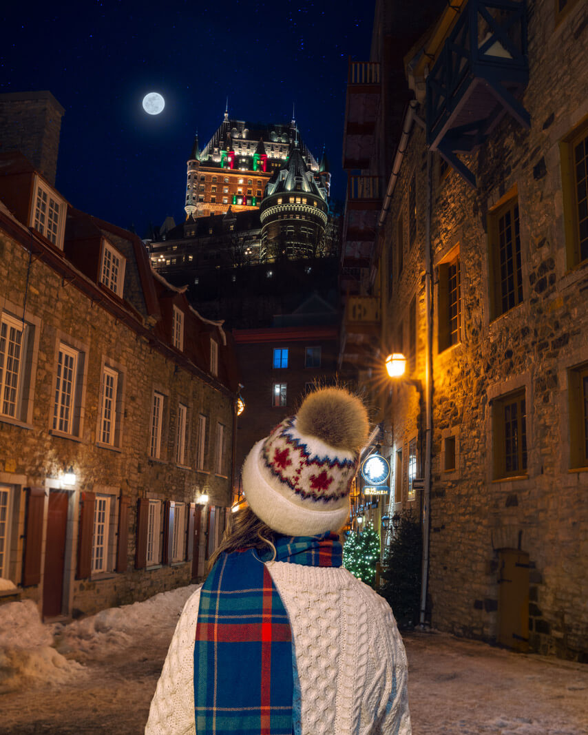 megan indoe looking at fairmont le chateau frontenac from quartier le petit champlain in quebec city canada