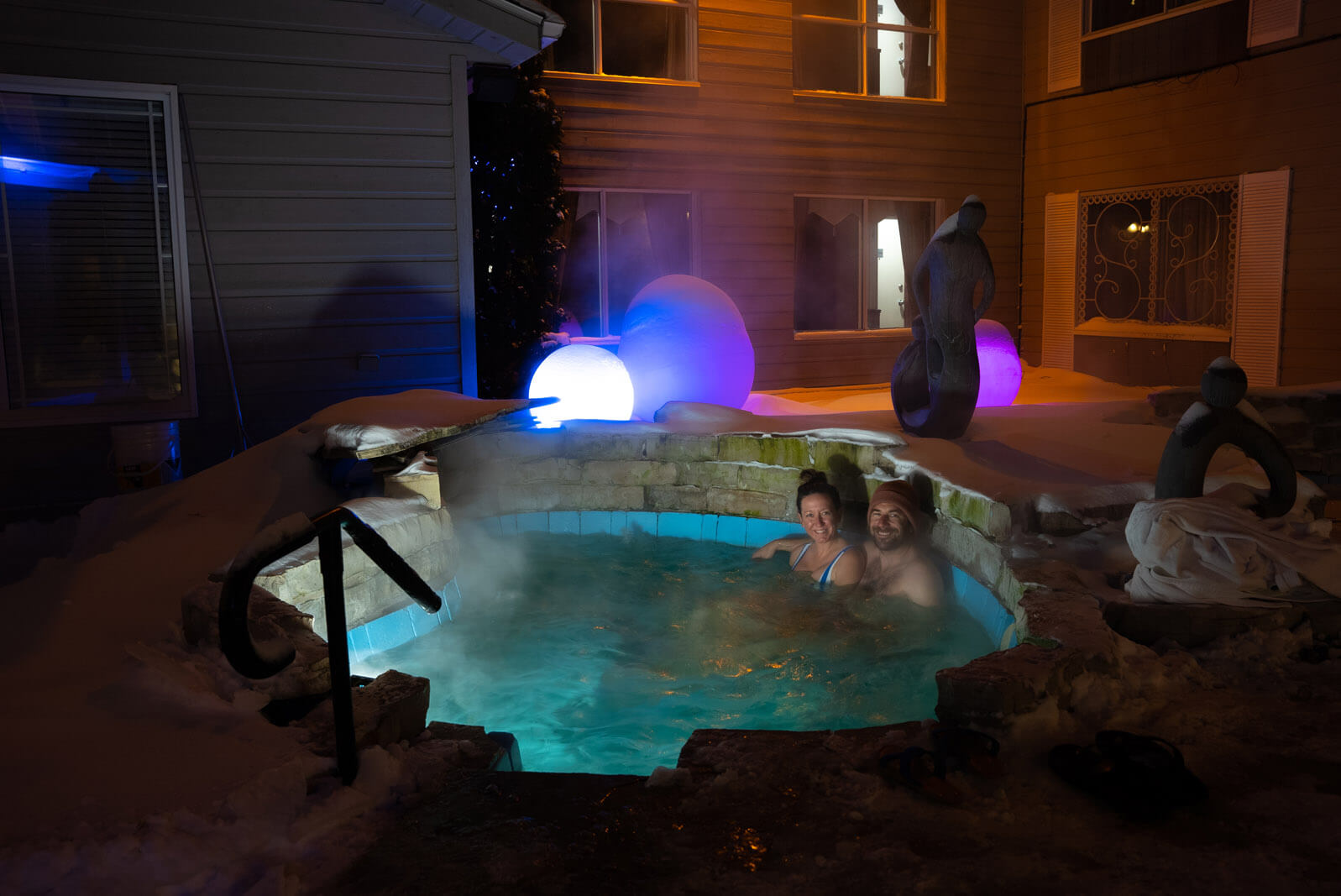 outdoor spa in winter at auberge des 21 in la baie saguenay quebec